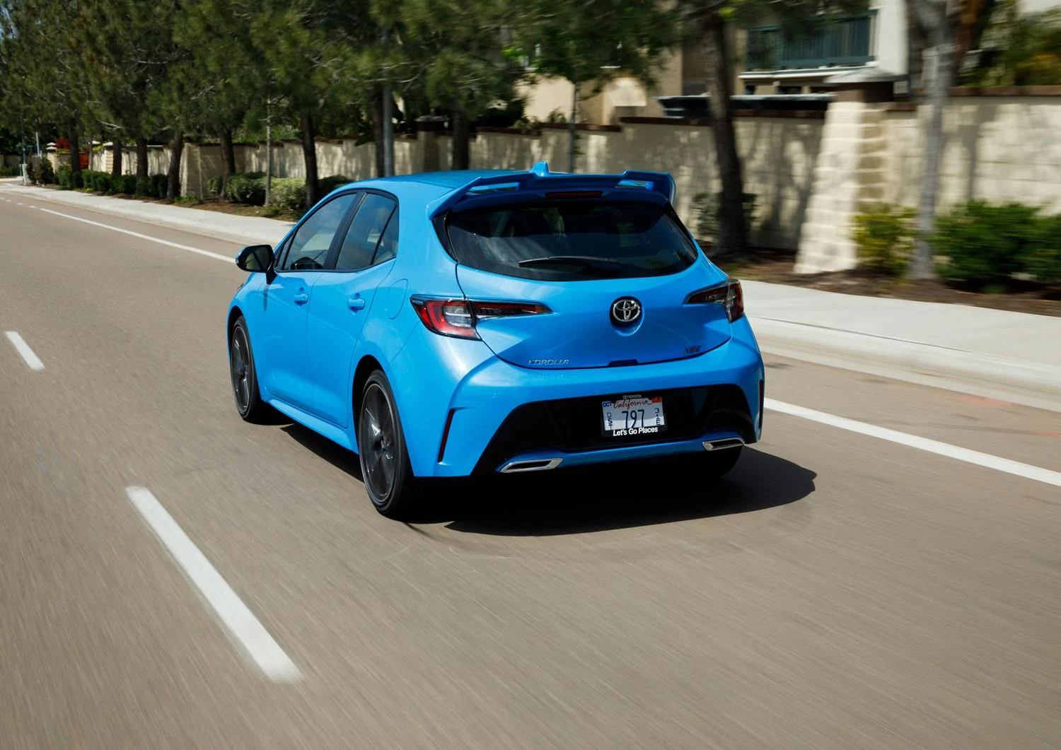 corolla-driving-rear.webp