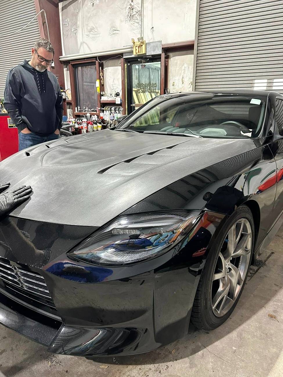 testing fitment of varis  carbon fiber hood.jpg